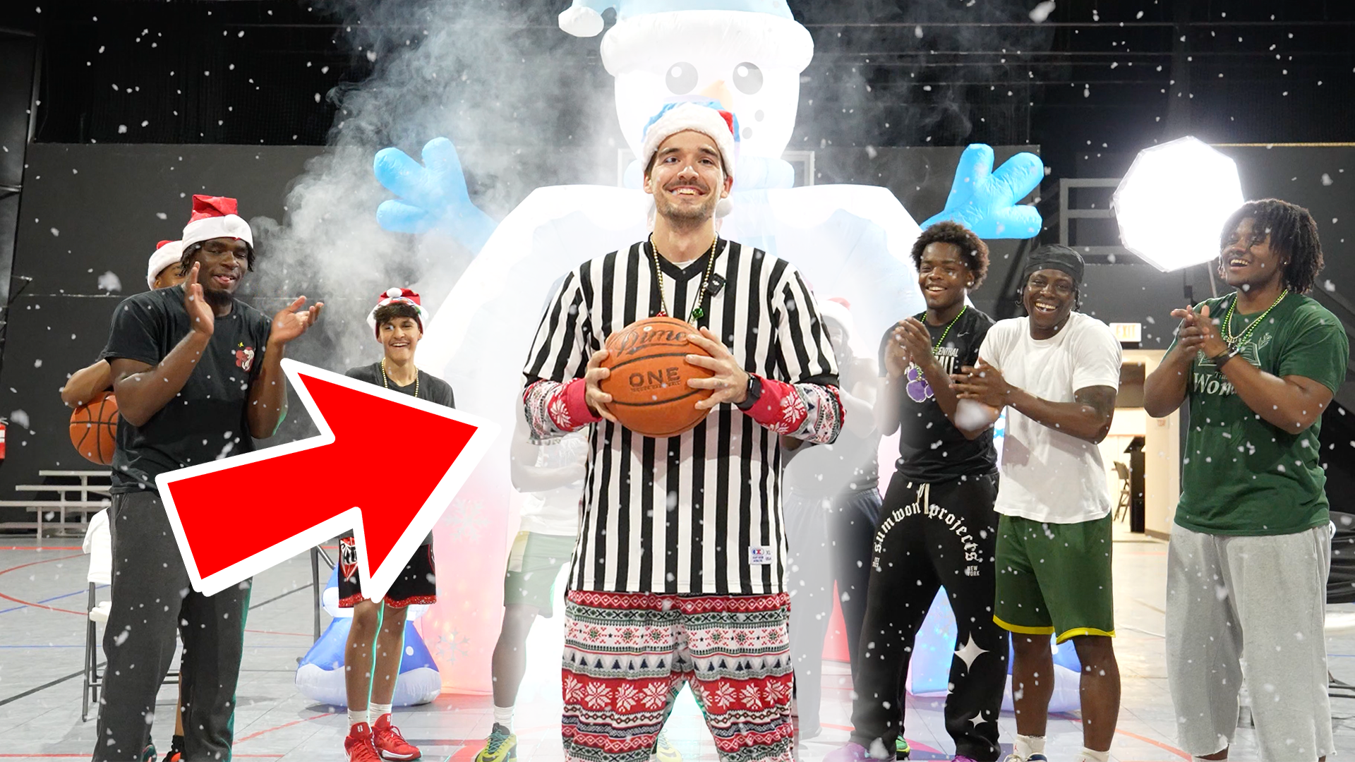 Seth McCoy refereeing a holiday basketball event while filming content with friends